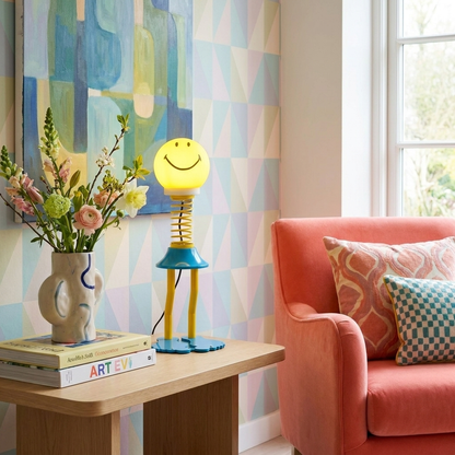 Smile Spring Table Lamp glowing in a lifestyle scene